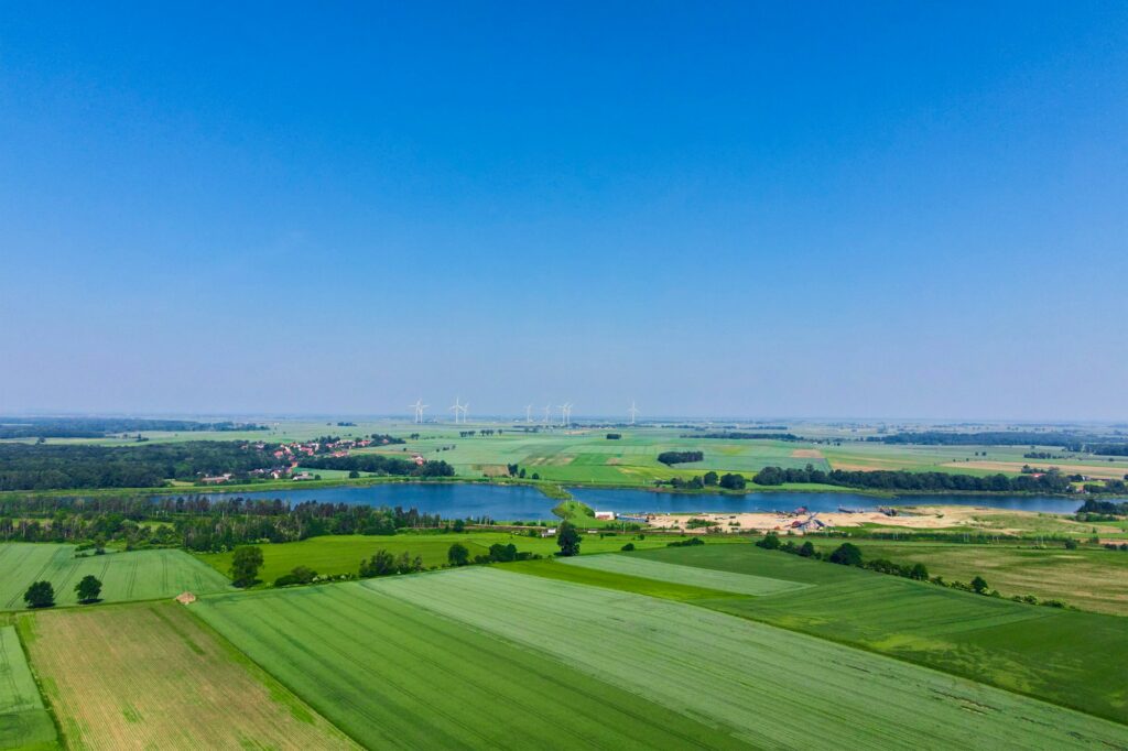 Windmill turbines in green field, Wind energy concept